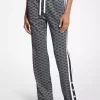 Pantaloni de trening din tricot elastic metalic cu imprimeu logo Pantaloni de trening din tricot elastic metalic cu imprimeu logo