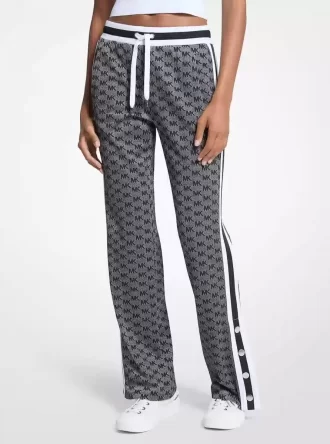 Pantaloni de trening din tricot elastic metalic cu imprimeu logo