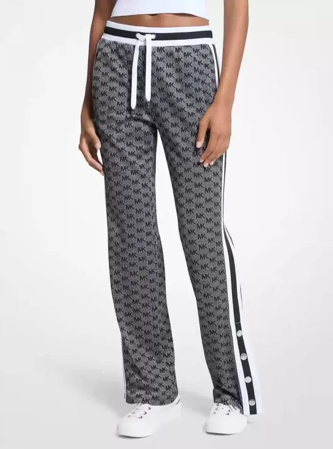 Pantaloni de trening din tricot elastic metalic cu imprimeu logo Pantaloni de trening din tricot elastic metalic cu imprimeu logo