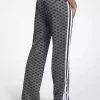 Pantaloni de trening din tricot elastic metalic cu imprimeu logo Pantaloni de trening din tricot elastic metalic cu imprimeu logo