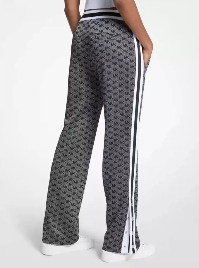 Pantaloni de trening din tricot elastic metalic cu imprimeu logo Pantaloni de trening din tricot elastic metalic cu imprimeu logo