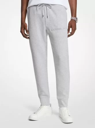 Pantaloni jogger din amestec de bumbac cu logo în relief
